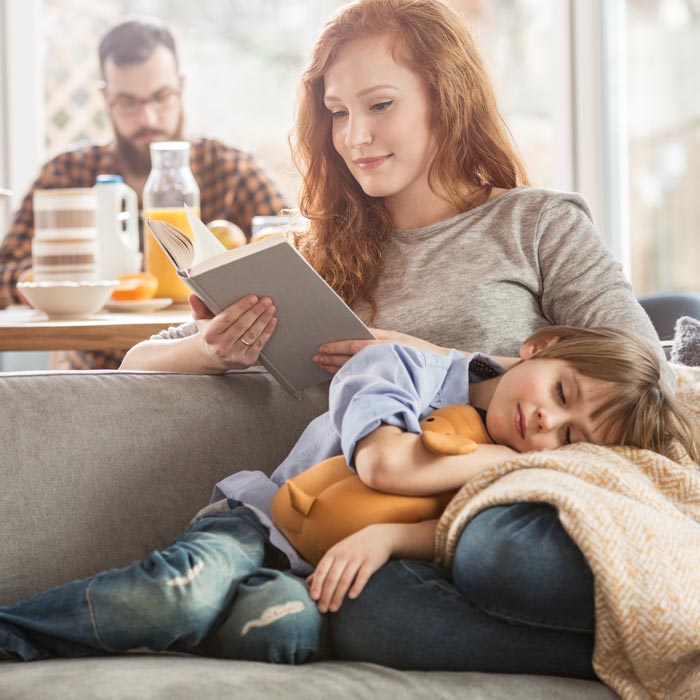 mother and son relaxing on couch