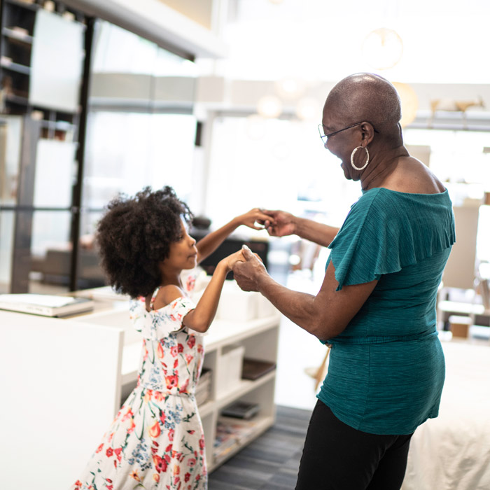 woman dancing with her daughter