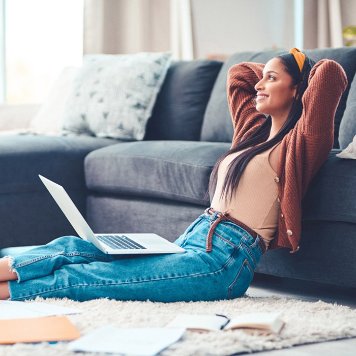 woman working on her lap top at home