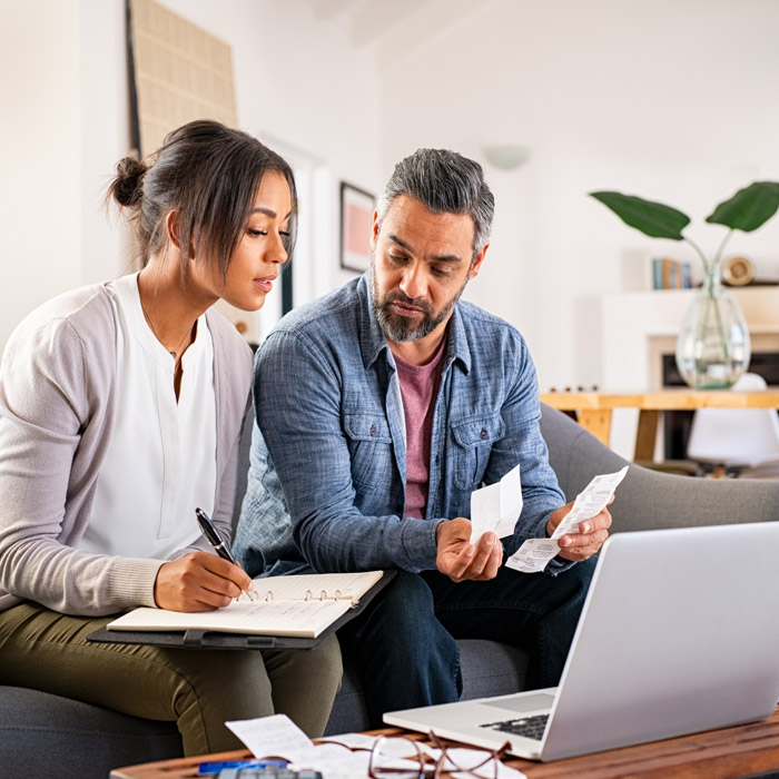 couple working on bills at home