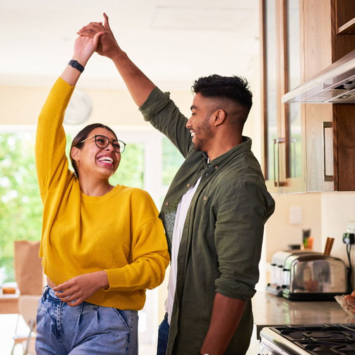 couple dancing in the kitchen